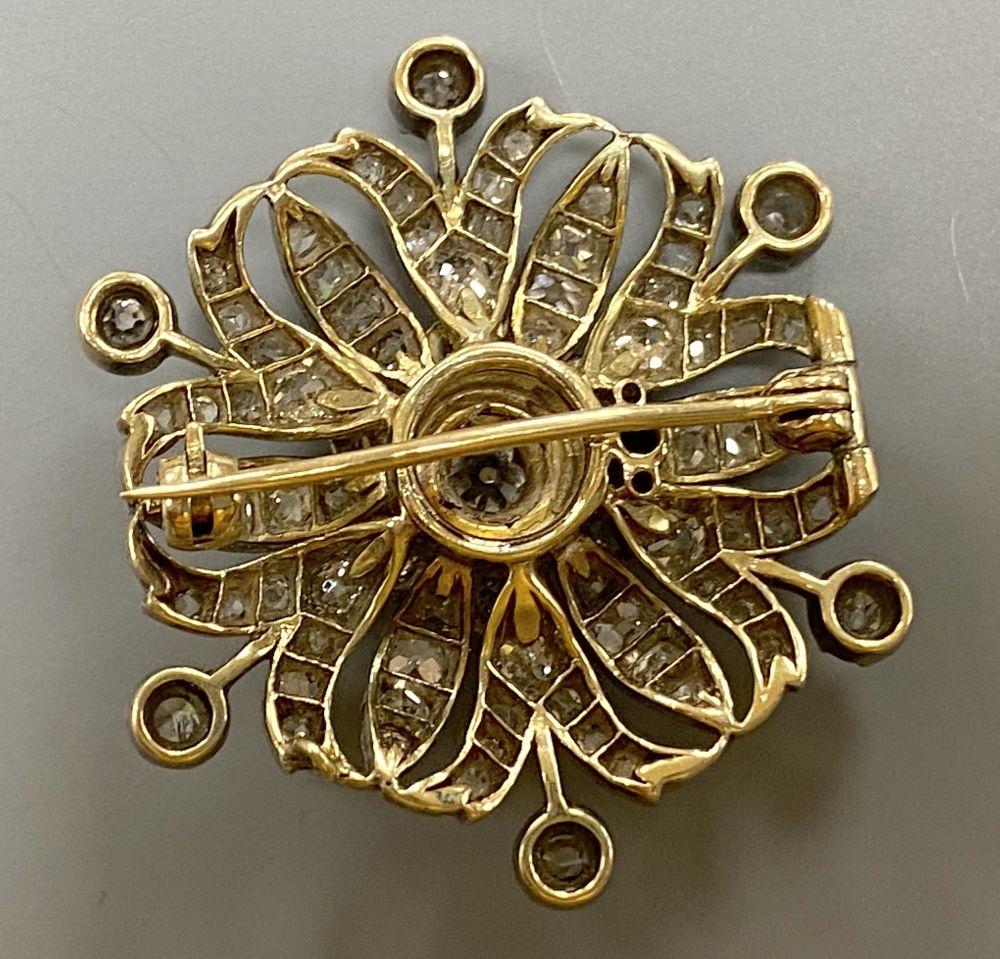 A Victorian pierced yellow and white metal, graduated diamond set circular brooch, 36mm, gross 12.7 grams,